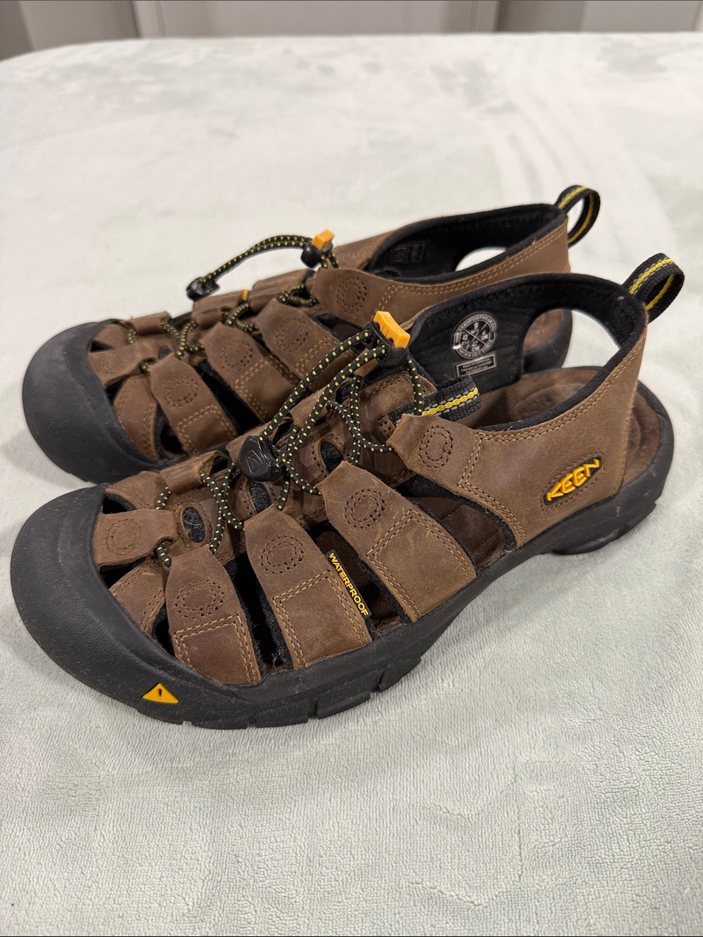 KEEN Brown and Black Men’s Closed-Toe Sandals with Yellow Accents. Never worn.